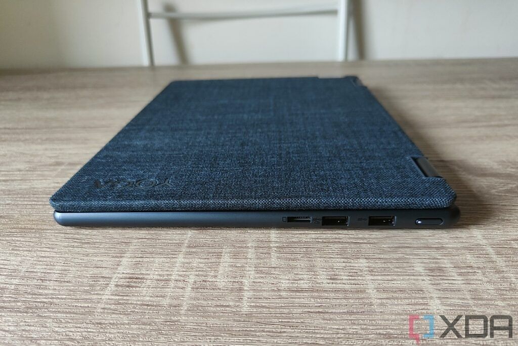 Right-side view of the Lenovo Yoga 6 Gen 7 with the lid closed showing two USB Type-A ports, a microSD card reader, and a power button.