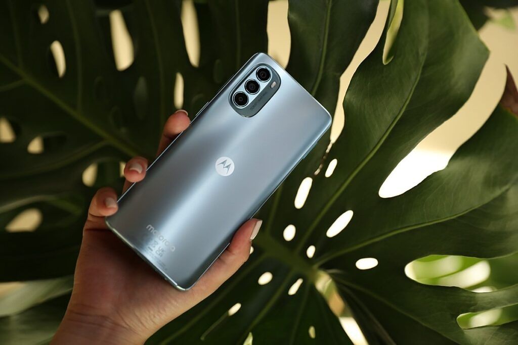 Moto G62 being held in the hand