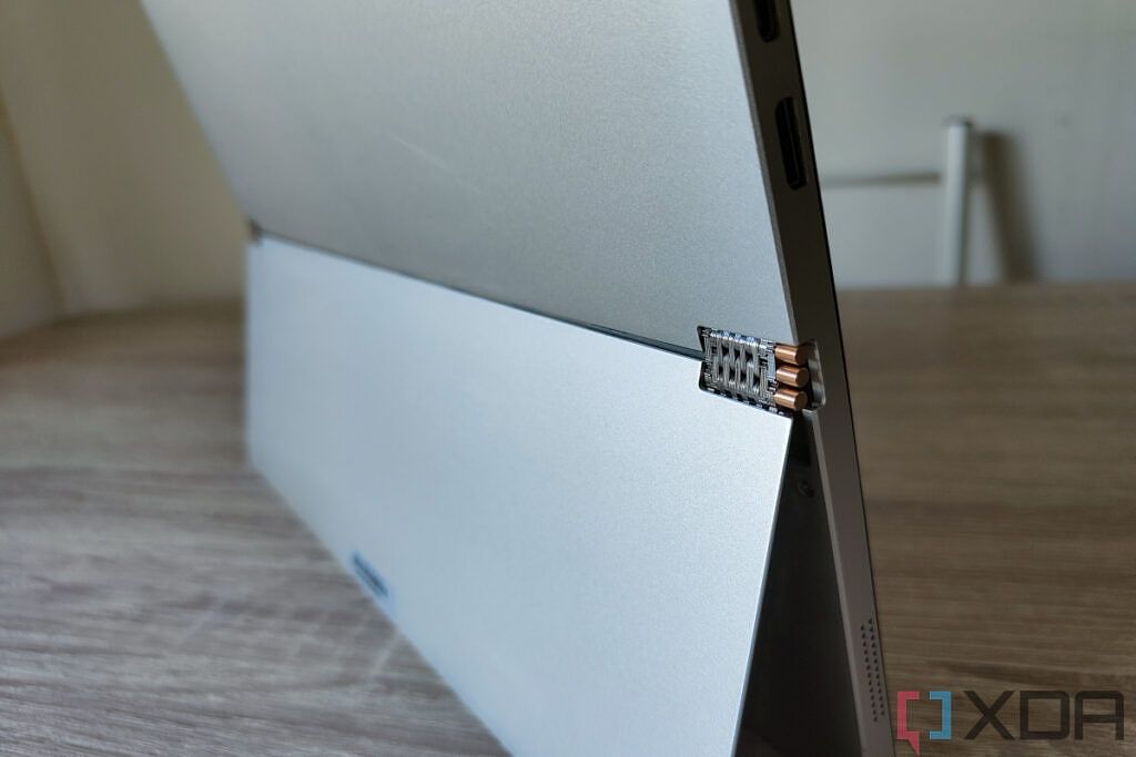 Angled view of the One-Netbook T1 showing the hinge mechanism of the kickstand
