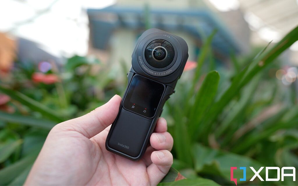Insta360 one rs 1-inch edition in the hand about to shoot a 360 video