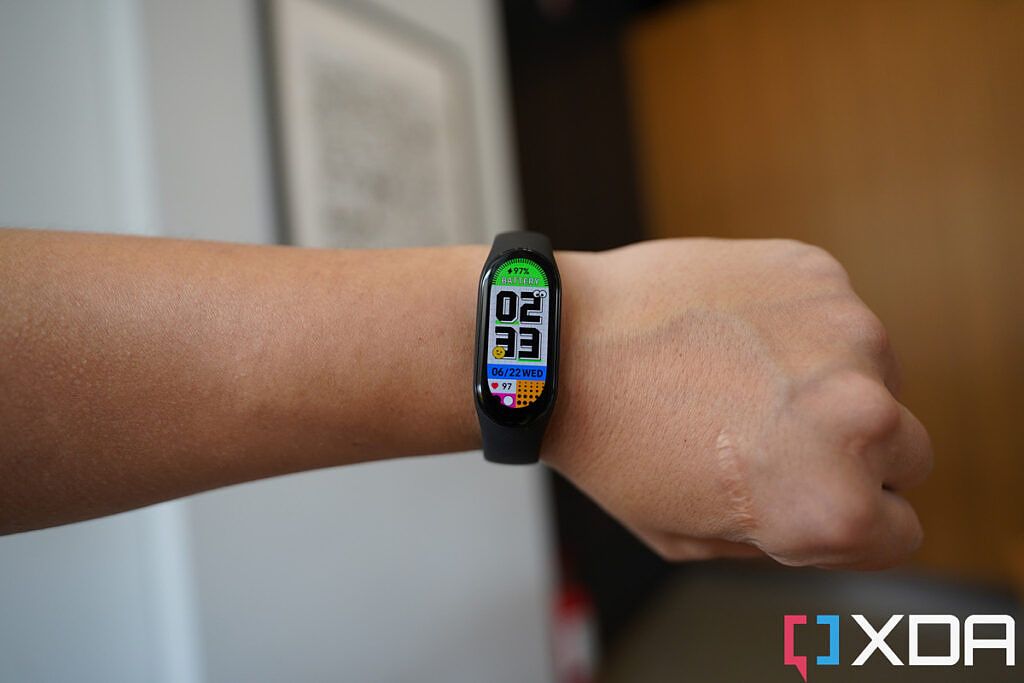 Xiaomi smart Band 7 worn on wrist with a white watchface