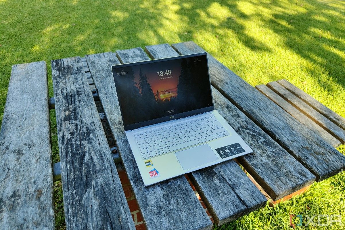 Angled view of the Acer Swift 3 (2022) displaying the Windows 11 lock screen