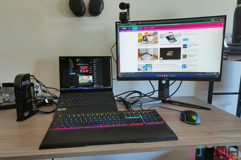 A laptop connected to an external monitor and various peripherals through a docking station