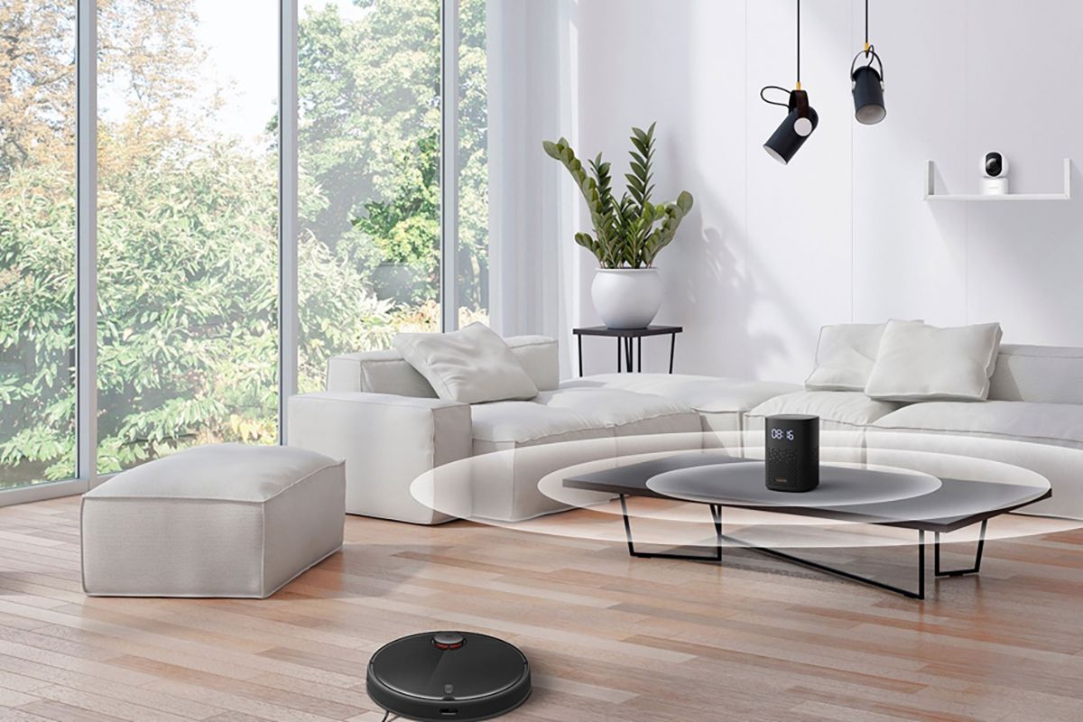 Xiaomi Smart Speaker IR Control on table in living room with other Xiaomi products.