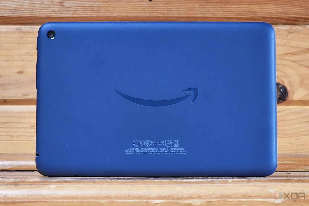 An Amazon Fire tablet with a signature smile on the back.