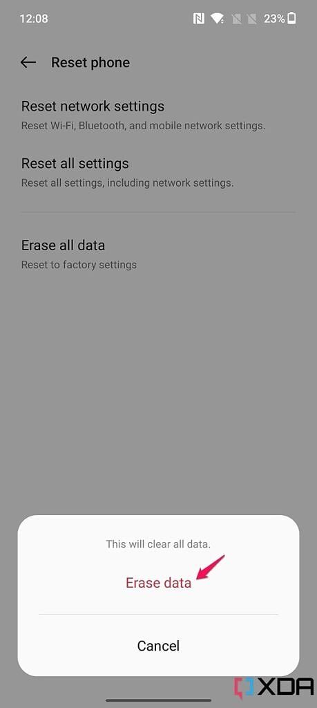 Screenshot of Erase all data pop-up on OnePlus 10T with pink arrow pointing at Erase data option.