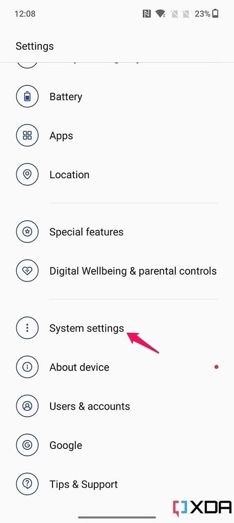Screenshot of device settings on the OnePlus 10T with pink arrow pointing at the System settings option.