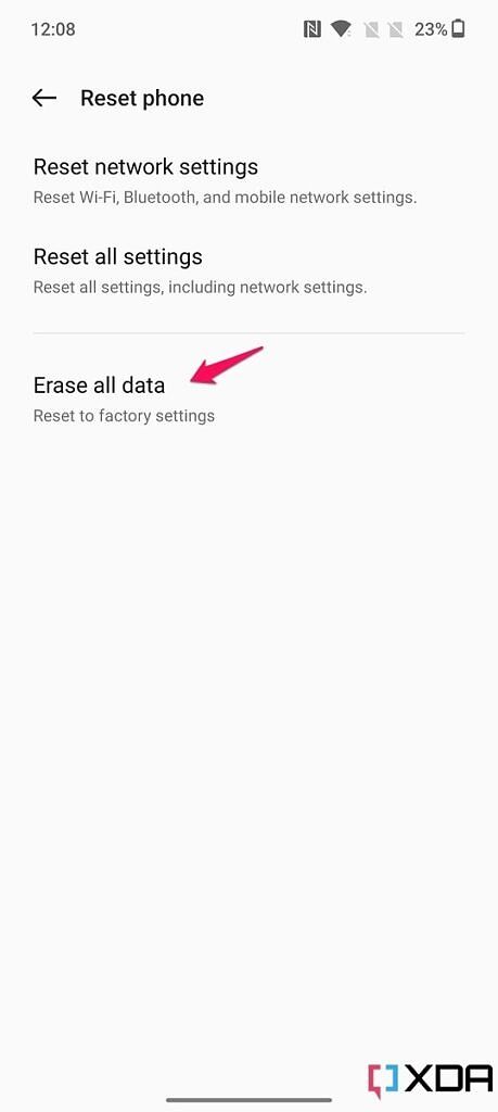 Screenshot of Reset phone option on the OnePlus 10T with pink arrow pointing at Erase all data option.
