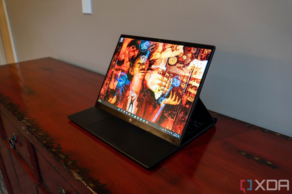 HP Elite Dragonfly Folio laptop in folio mode on a wooden piece of furniture
