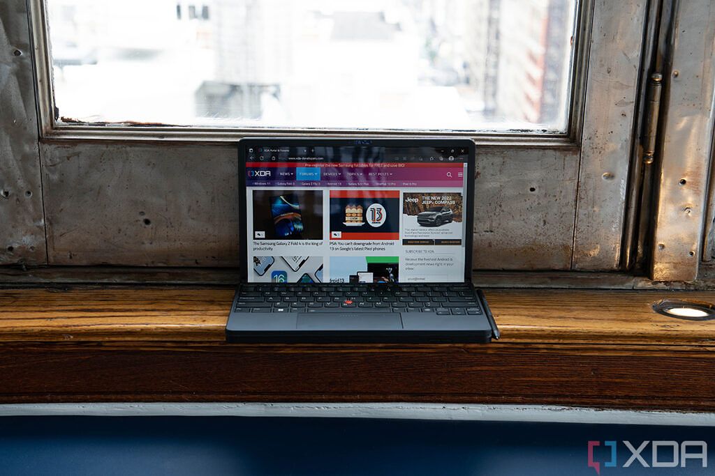 Lenovo ThinkPad X1 Fold Gen 2 in laptop mode displaying the XDA homepage