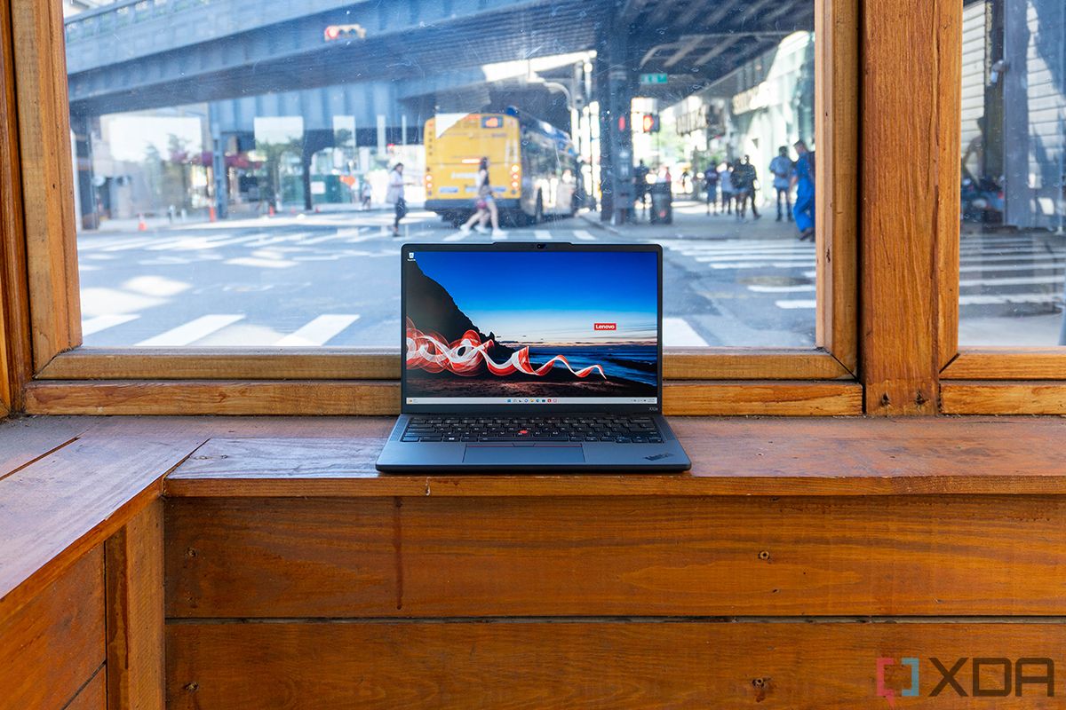 Laptop with a street and cars in the background