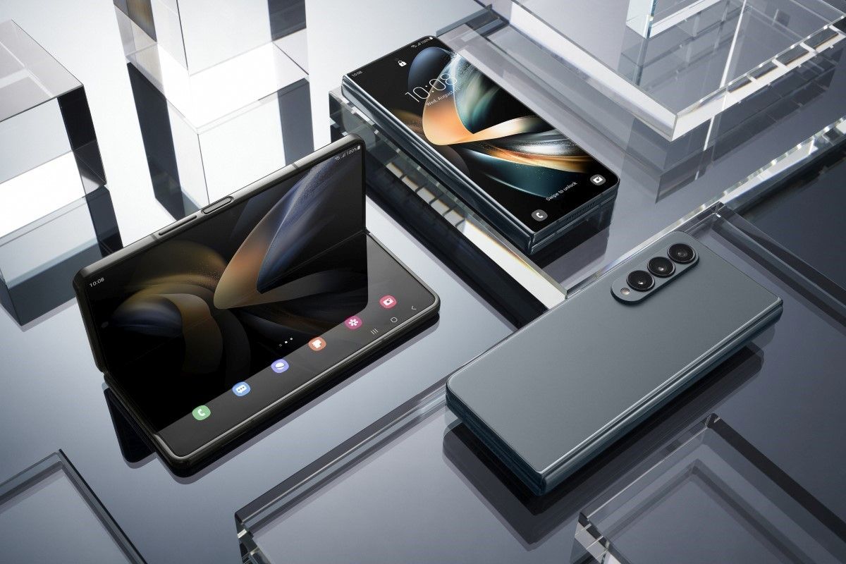 Samsung Galaxy Z Fold 4 in all orientations on gray background placed next to transparent geometric objects.