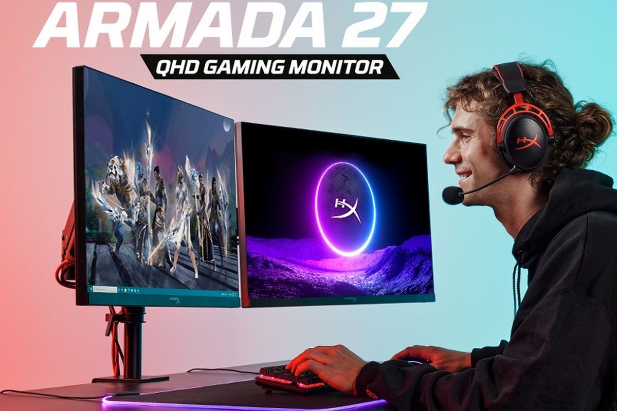 A man sitting in front of two HyperX Armada 27 monitors next to each other