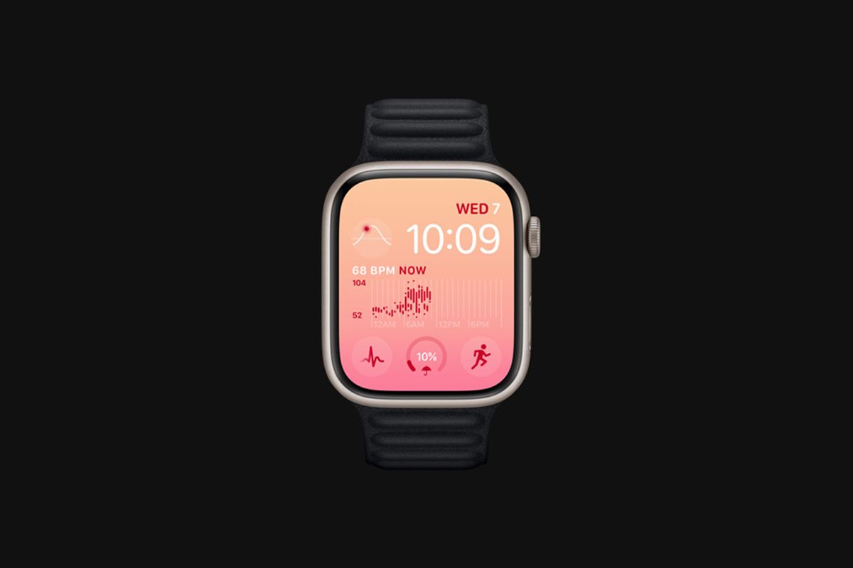 Apple Watch Series 8 with heart rate watch face on gray background.