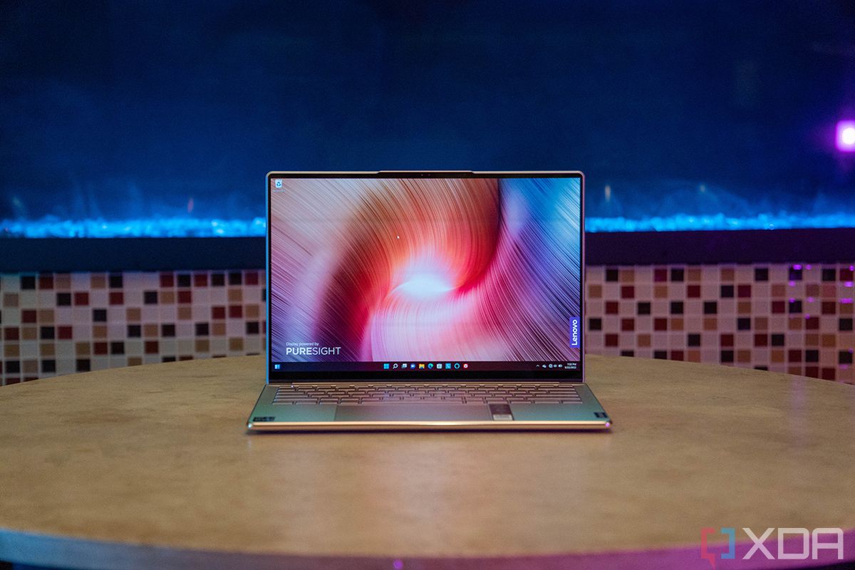 Lenovo laptop with blue lights in background