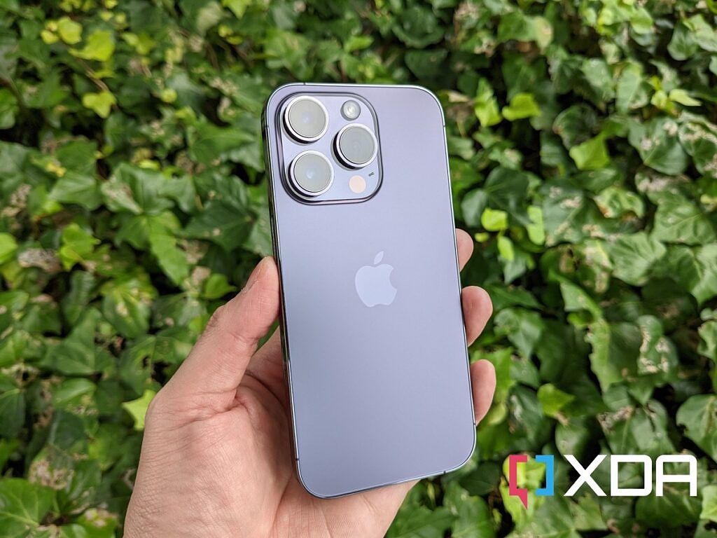 iPhone 14 Pro in front of plants 