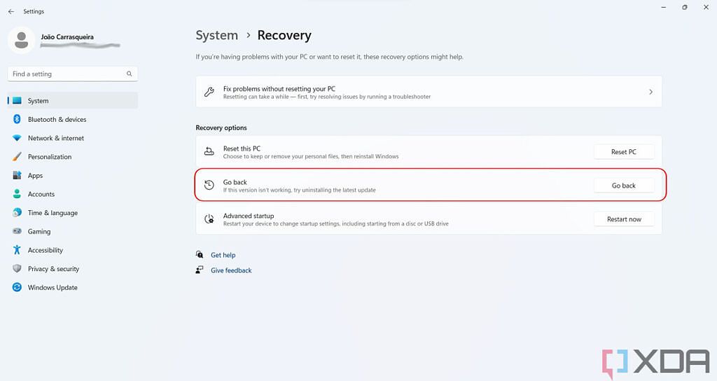 Windows 11 Settings Recovery page with Go back option highlighted