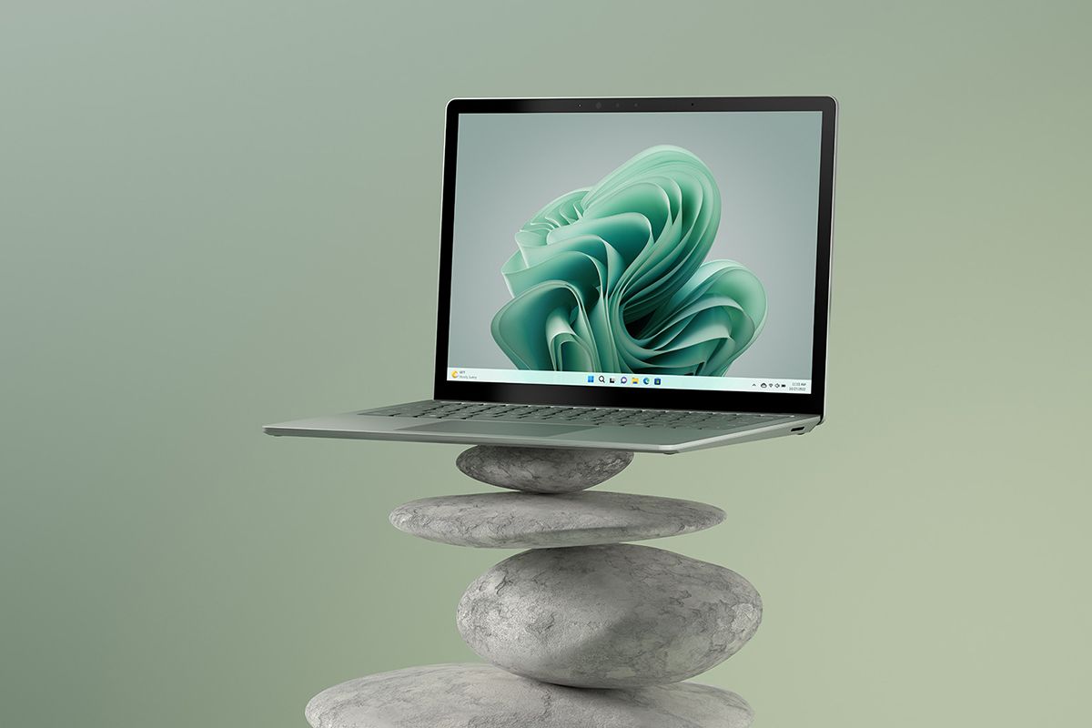 Surface Laptop 5 on top of stacked rocks