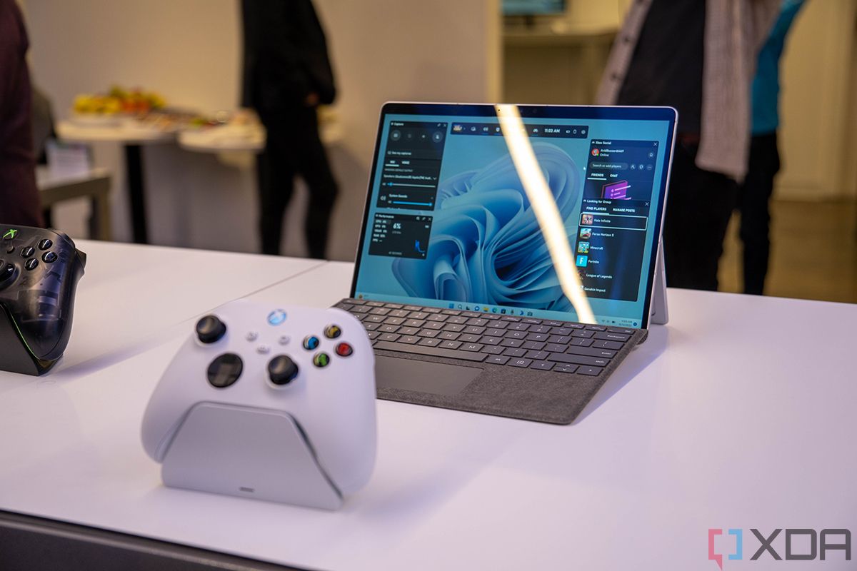 A Surface Pro 9 with 5G on a desk with an Xbox Wireless Controller in front of it