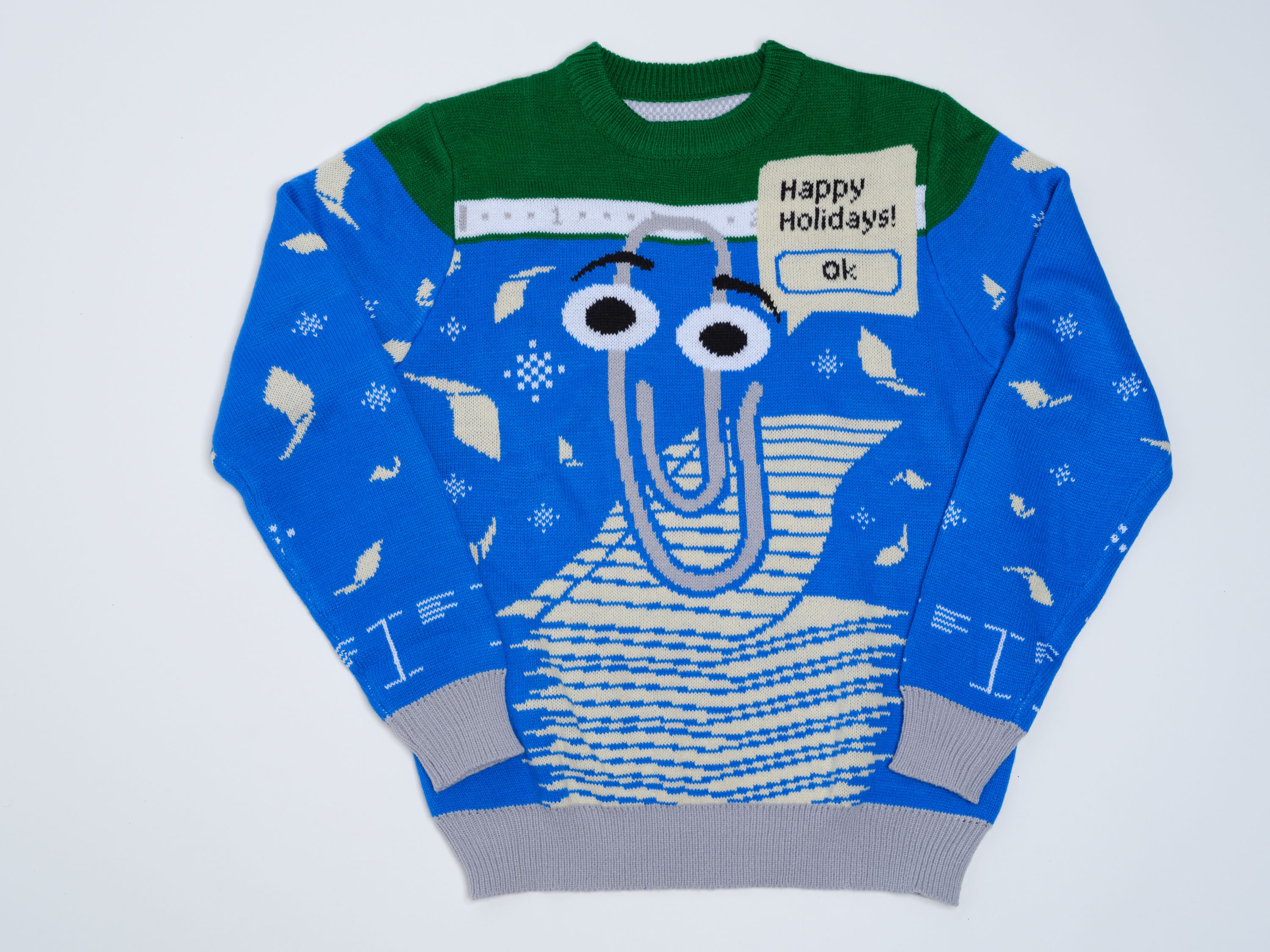 Blue and green sweater with Clippy on the front, saying Happy Holidays