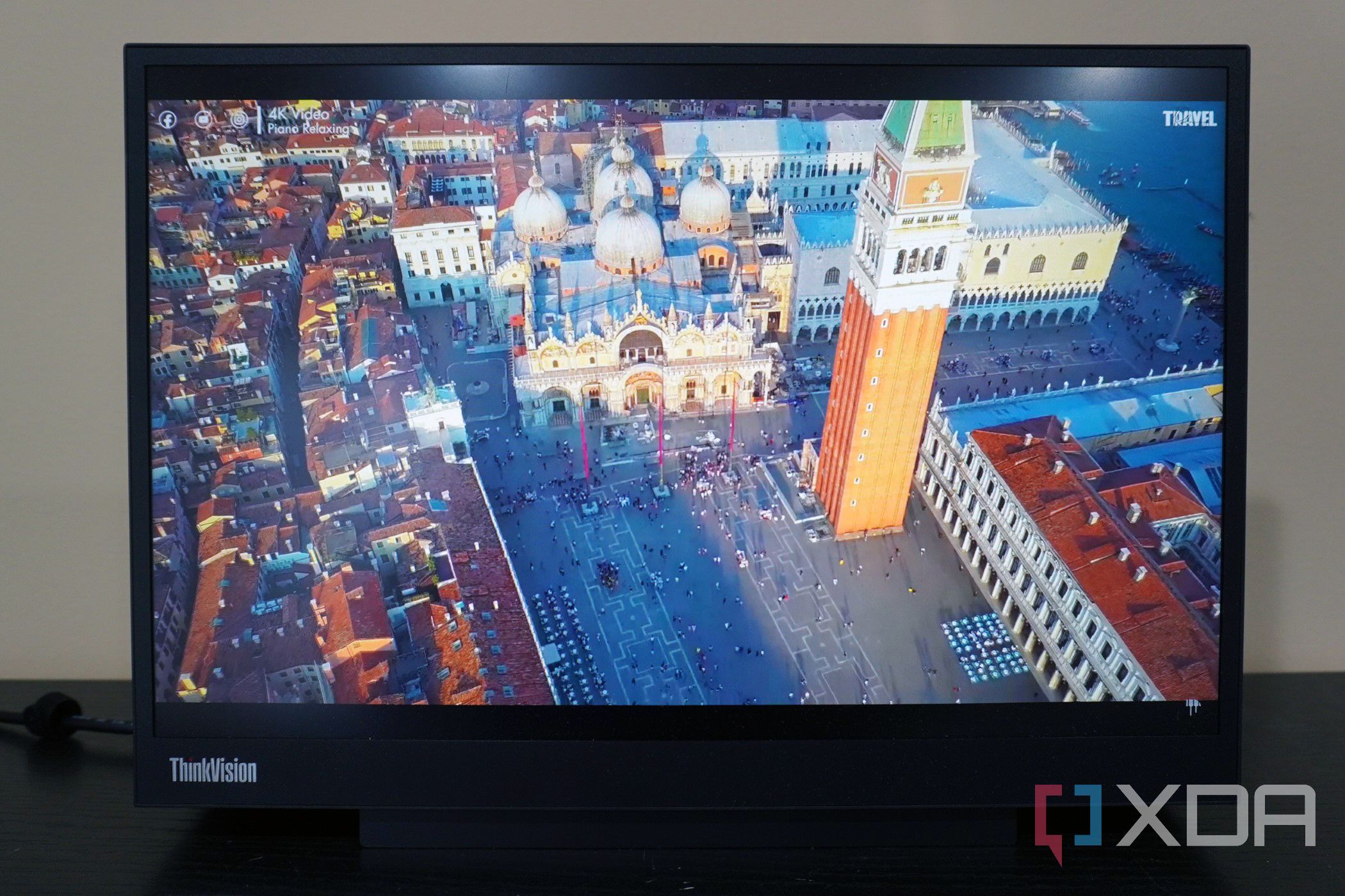 A city in Italy, showcased on the display of the Lenovo-ThinkVision-M14d.