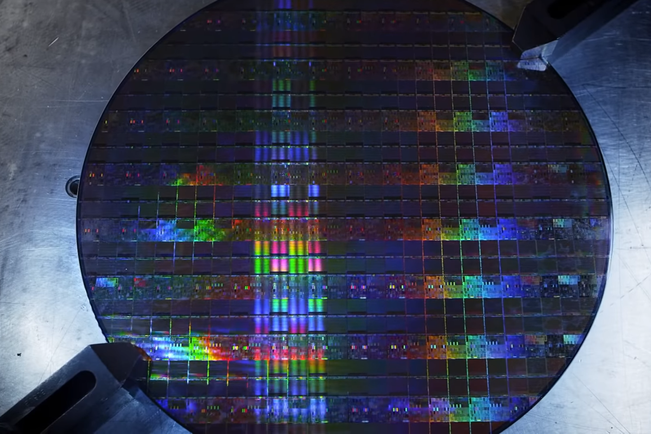 A silicon wafer of Intel CPUs moments before destruction.