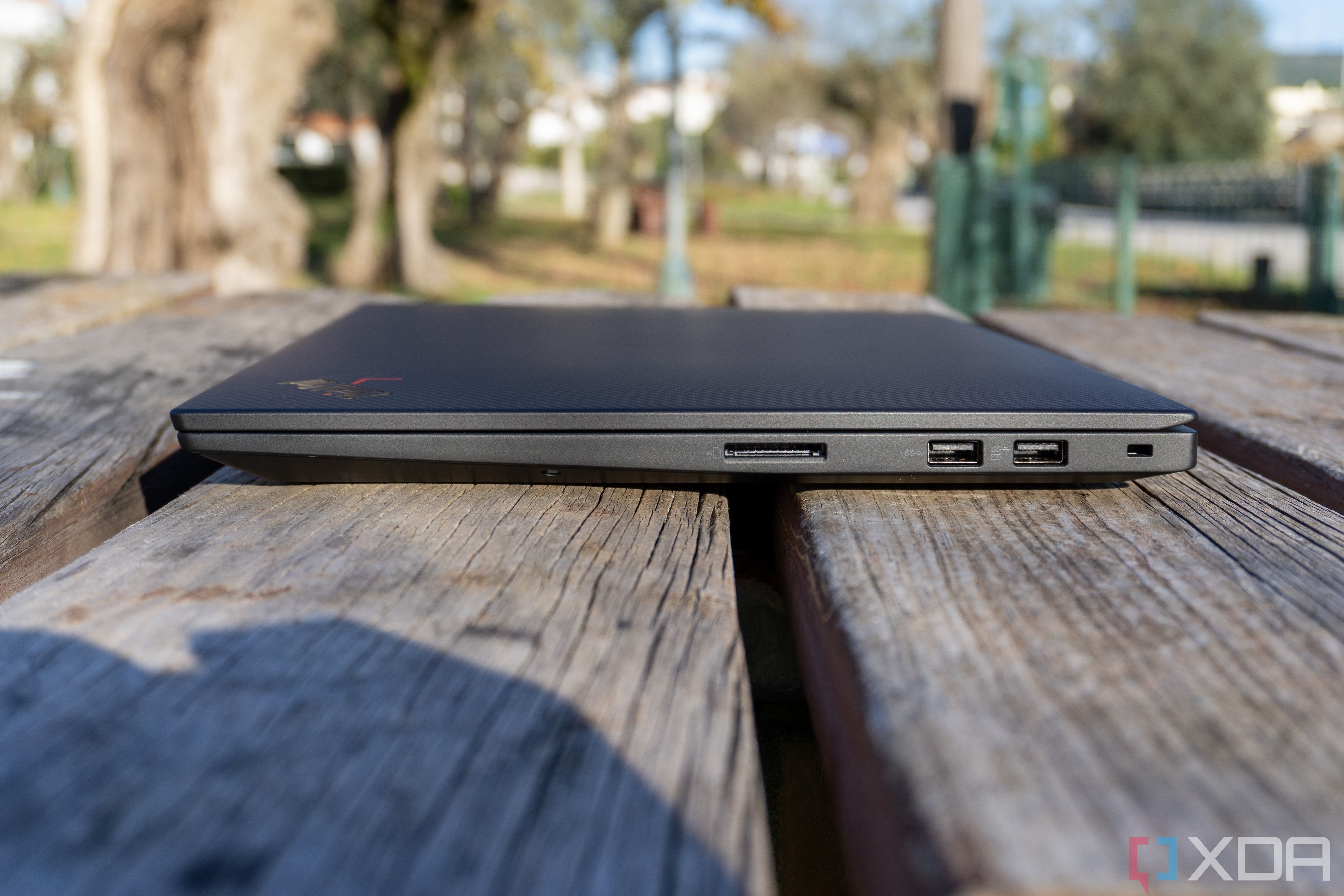 A right-side view of the Lenovo ThinkPad X1 Extreme Gen 5 laptop, showing an SD card slot, two USB Type-A ports, and a Kensington lock slot