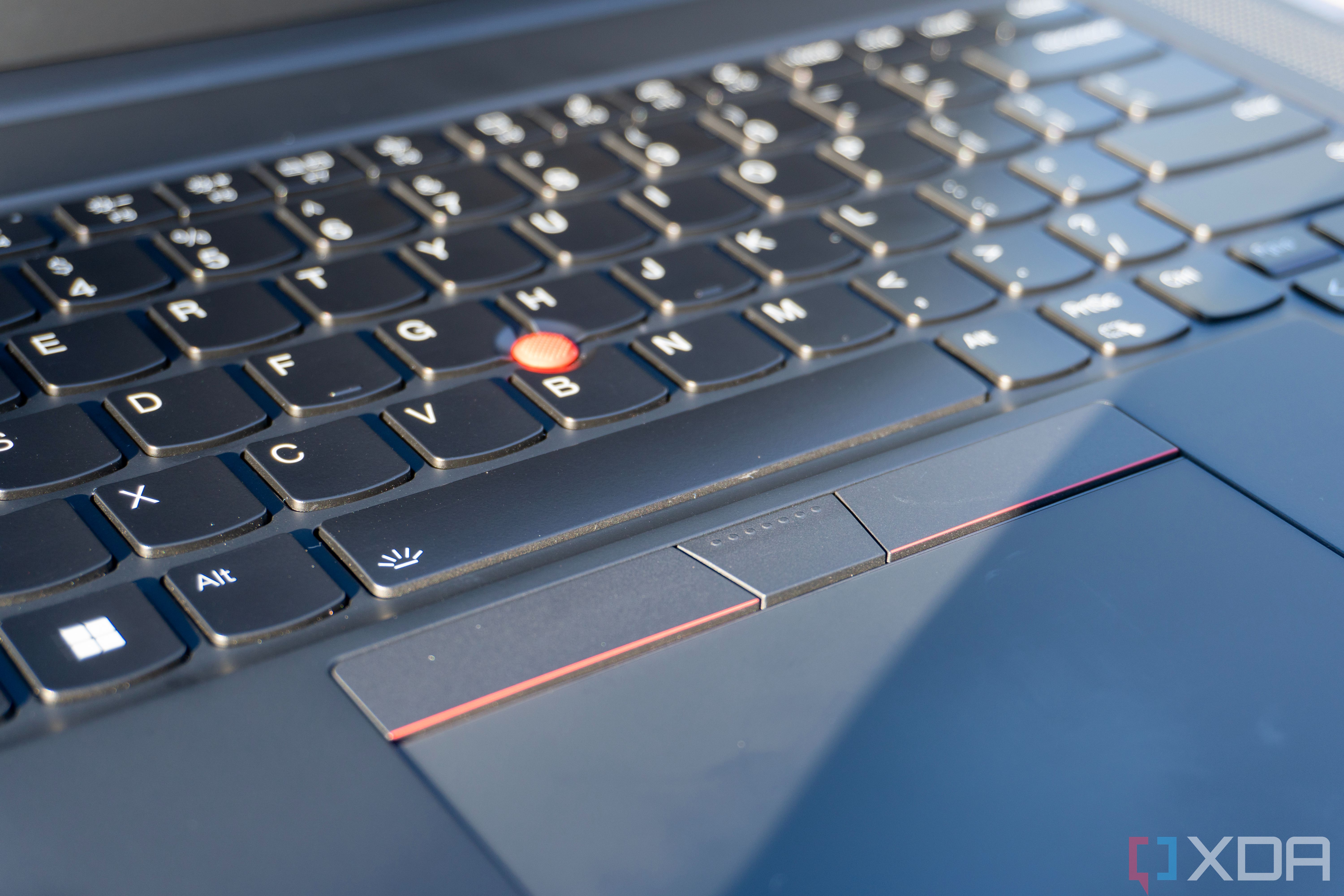 Close-up view of the mouse buttons and red TrackPoint on the Lenovo ThinkPad X1 Extreme Gen 5