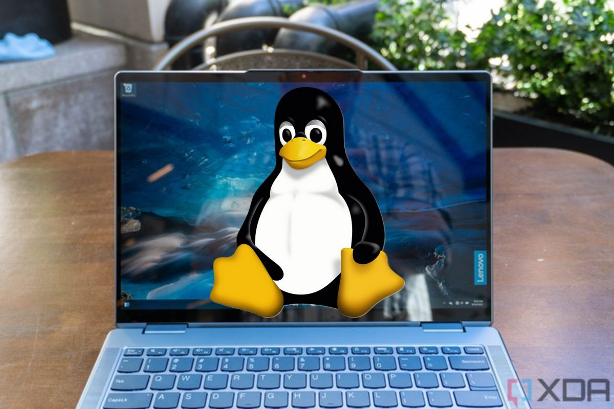 A front view of the Lenovo Yoga 7i's display with the Linux logo laid on top of it