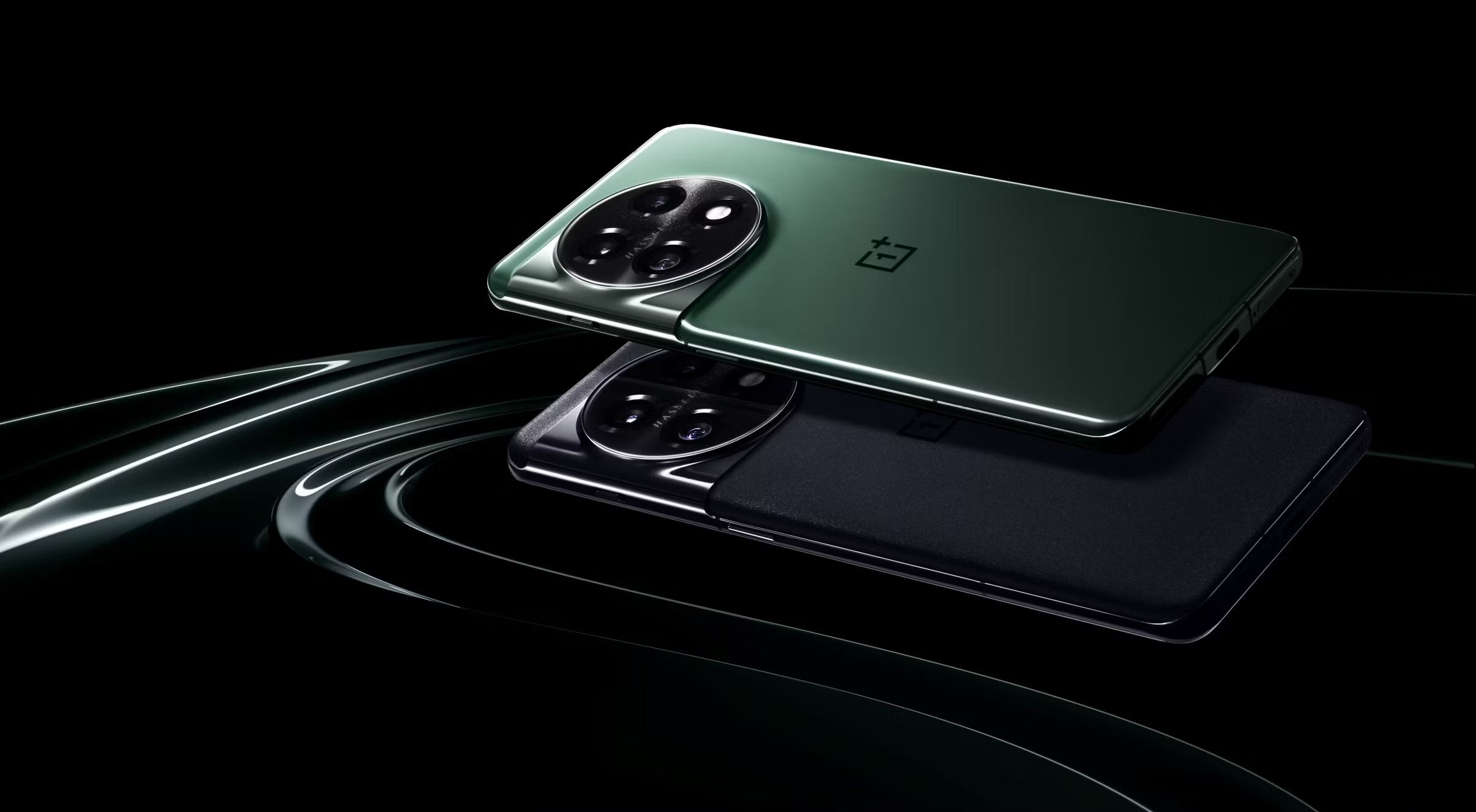 Black and green OnePlus 11 on stylized black background.