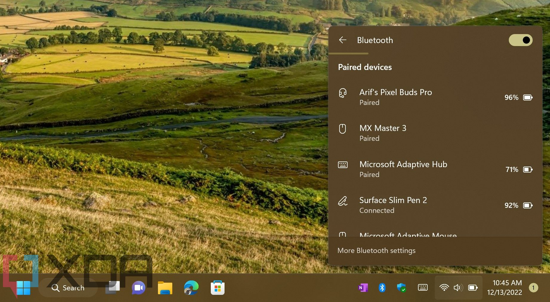 The Quick Settings menu showing Bluetooth devices appears in Windows 11