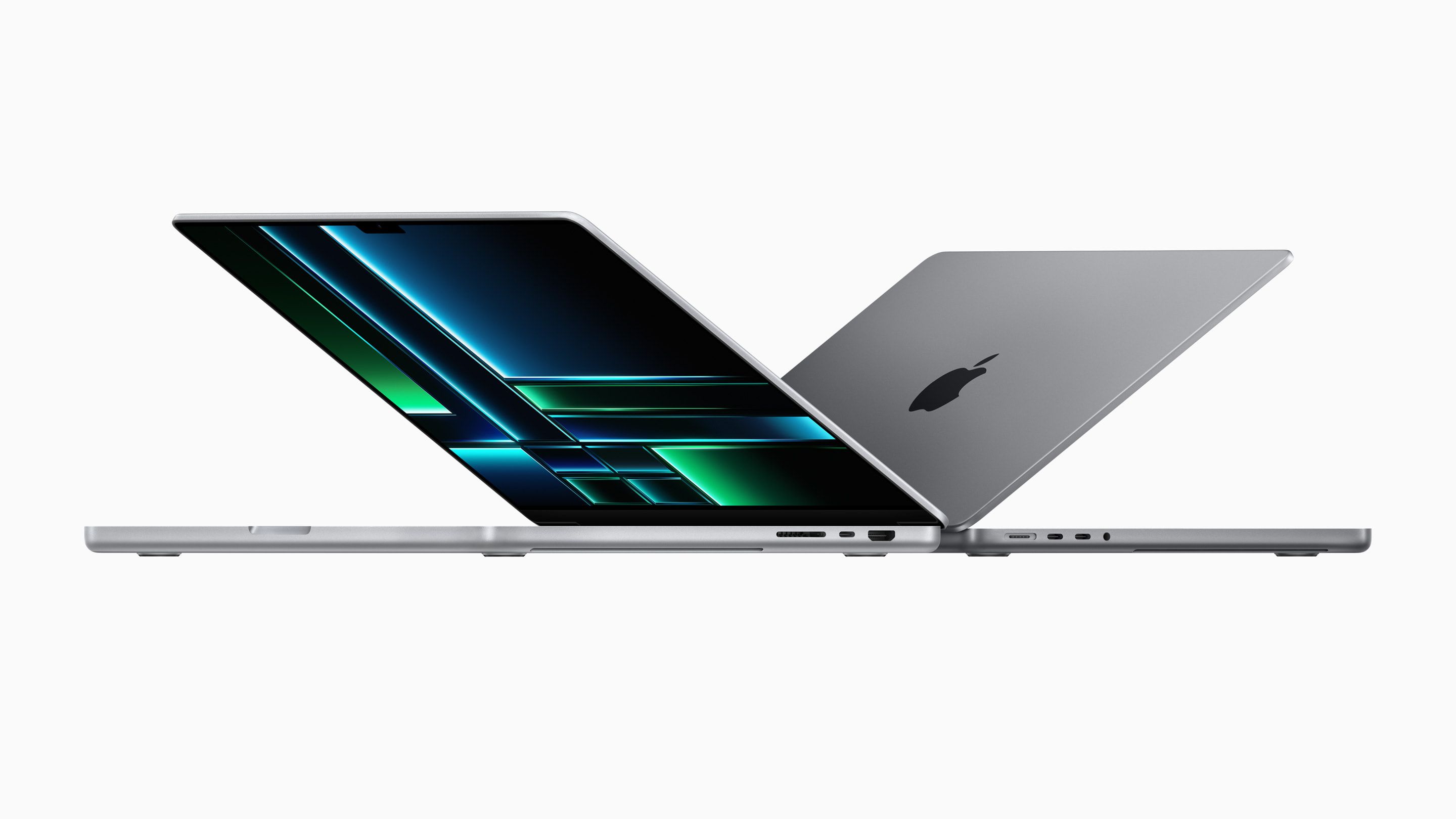 The MacBook Pro open with screens back to back and side by side.