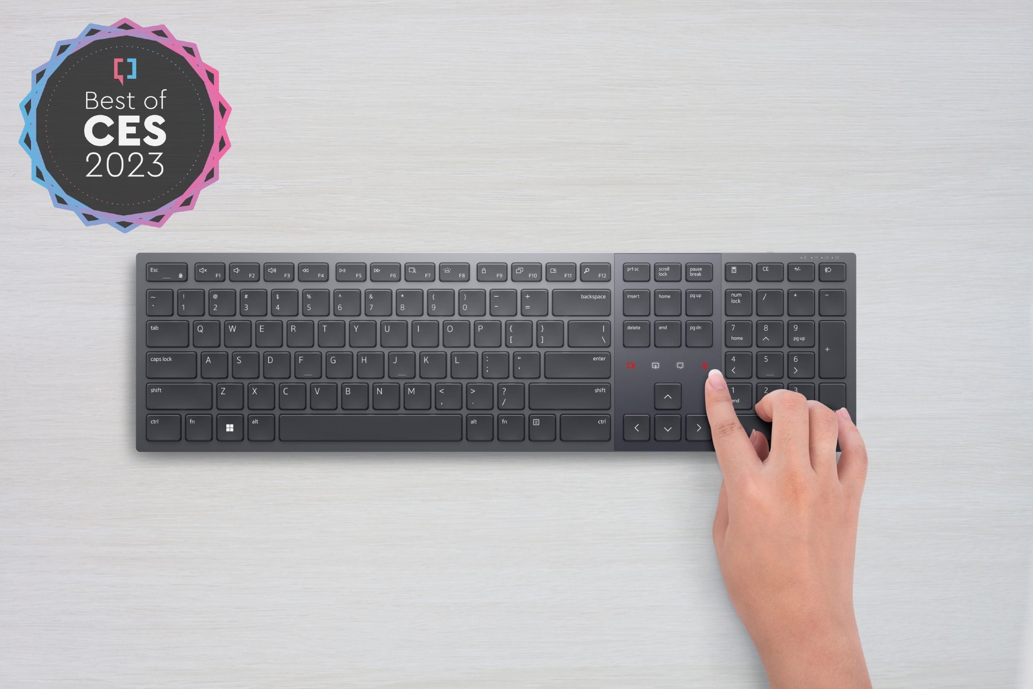 Overhead view of the Dell Premier Collaboration Keyboard with touch-based shortcuts for Zoom features. The top left corner of the image has a badge reading 
