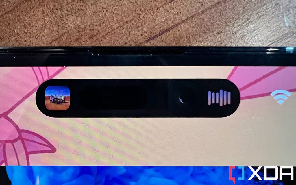 Dynamic Island on the iPhone 14 Pro Max showing background music playback