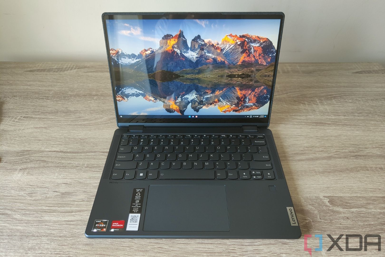 Front view of the Lenovo Yoga 6 with the lid open at 90 degrees, showing the Windows 11 desktop