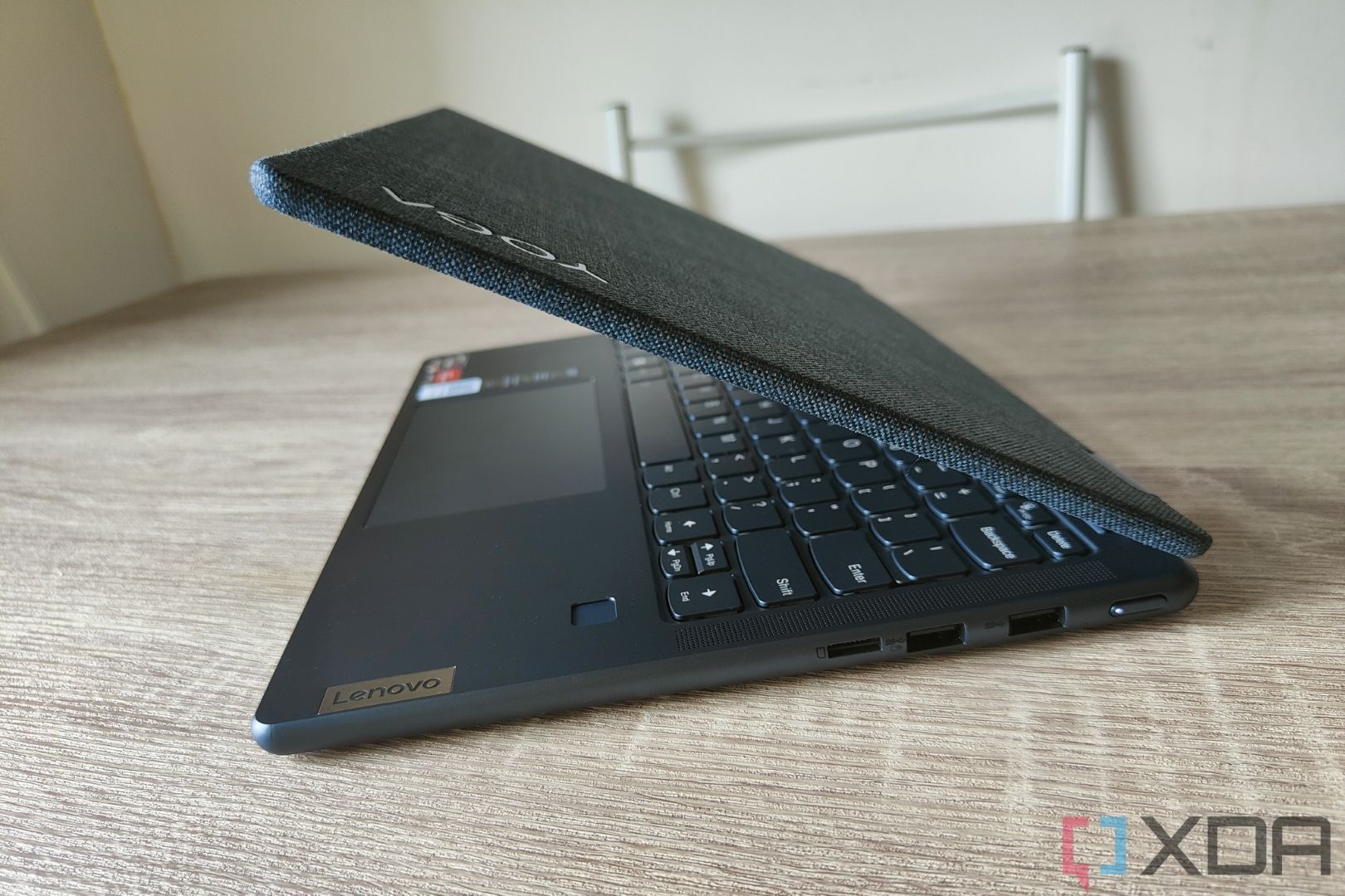 Side view of the Lenovo Yoga 6 facing left with the lid open at 45 degrees