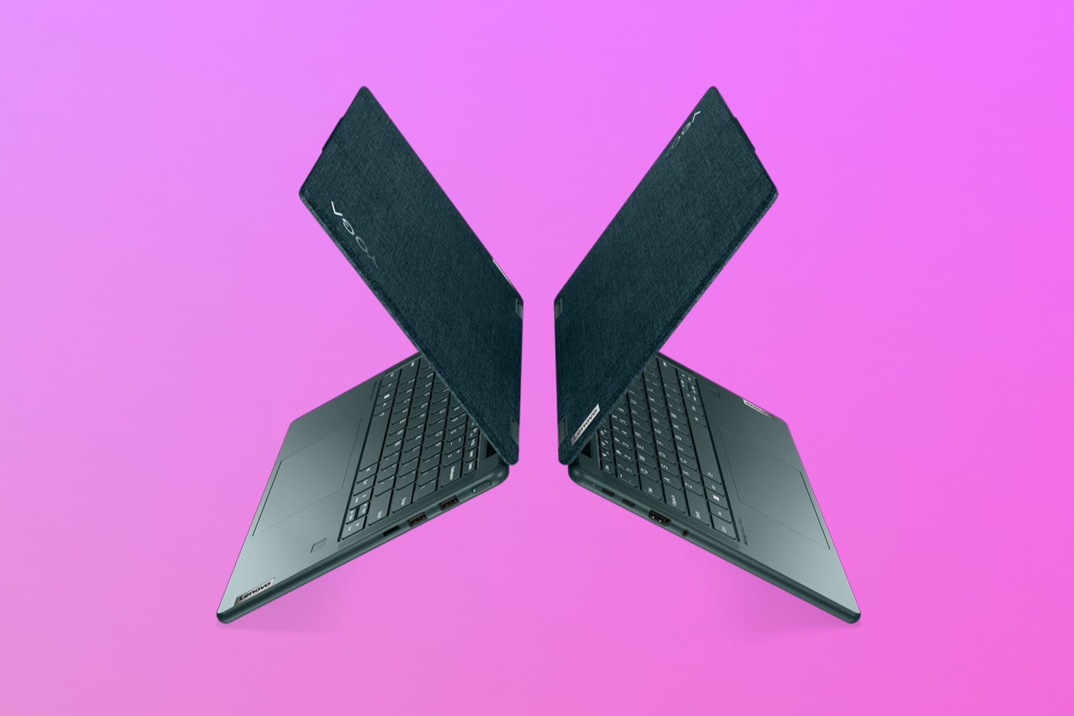 Side view of two Lenovo Yoga 6 laptops with aluminum tops back to back over a pink and purple gradient background