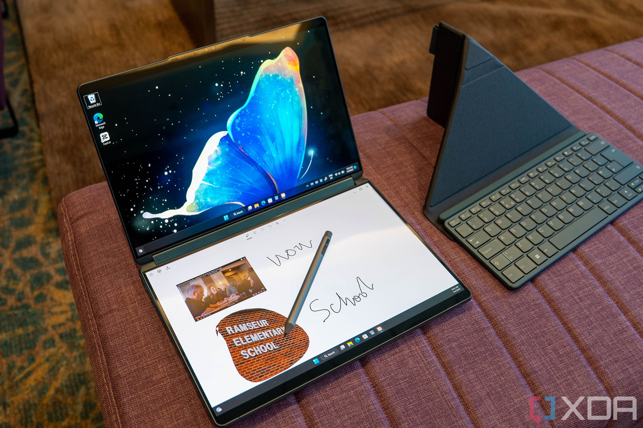 Pen on top of a dual-screen laptop