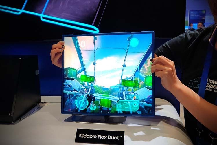 Person showcasing Samsung Display's Slideable Flex Duet prototype at CES 2023.