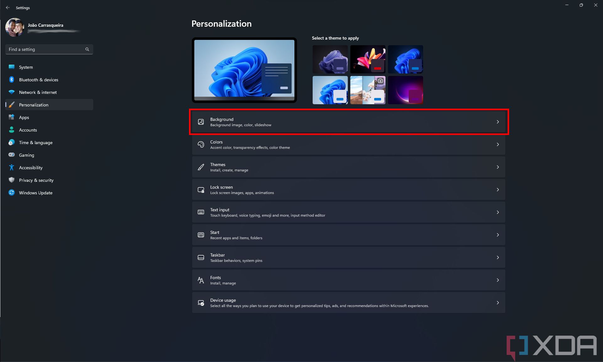 Screenshot of the Windows 11 Settings Personalization page with the Background option highlighted