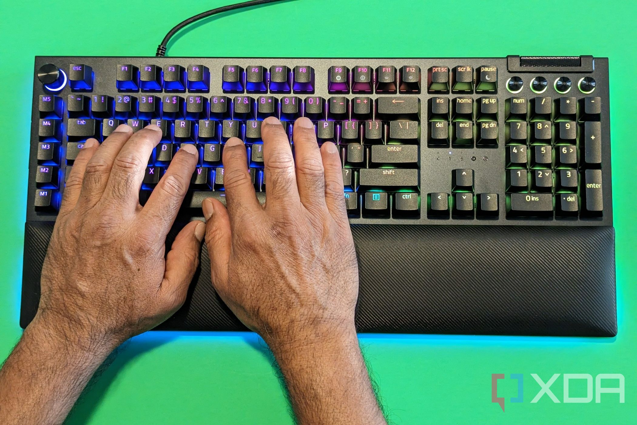 A man with his hands on the Razer Blackwidow V4 Pro Keyboard 