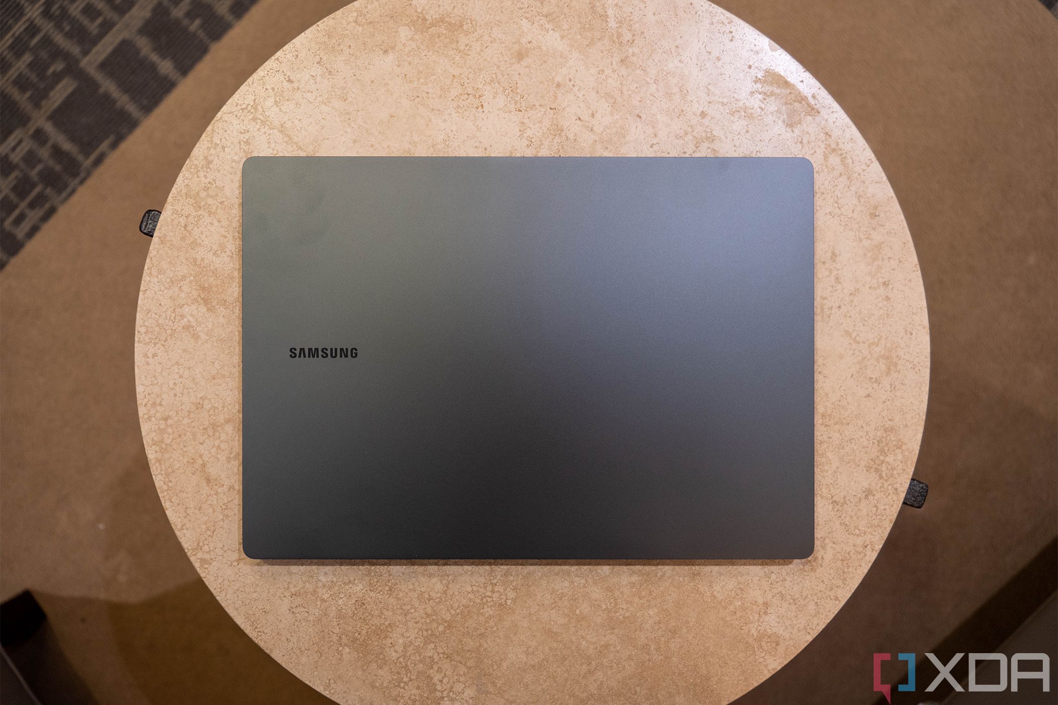 Top down view of gray laptop that says Samsung on it