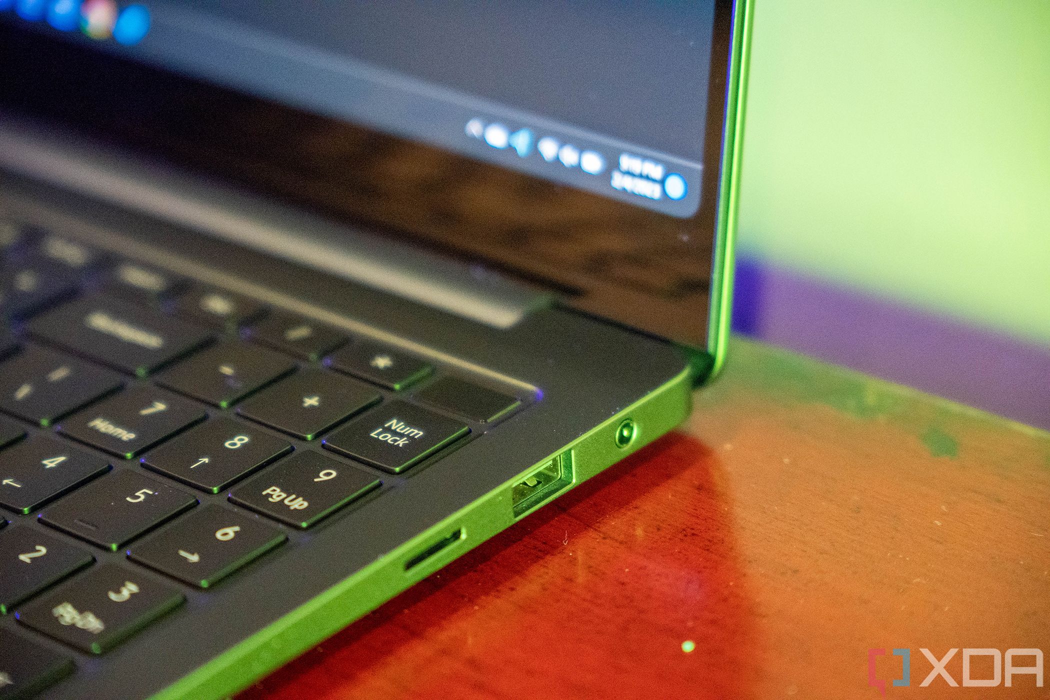 Angled view of laptop with USB Type-A port, 3.5mm audio, and microSD