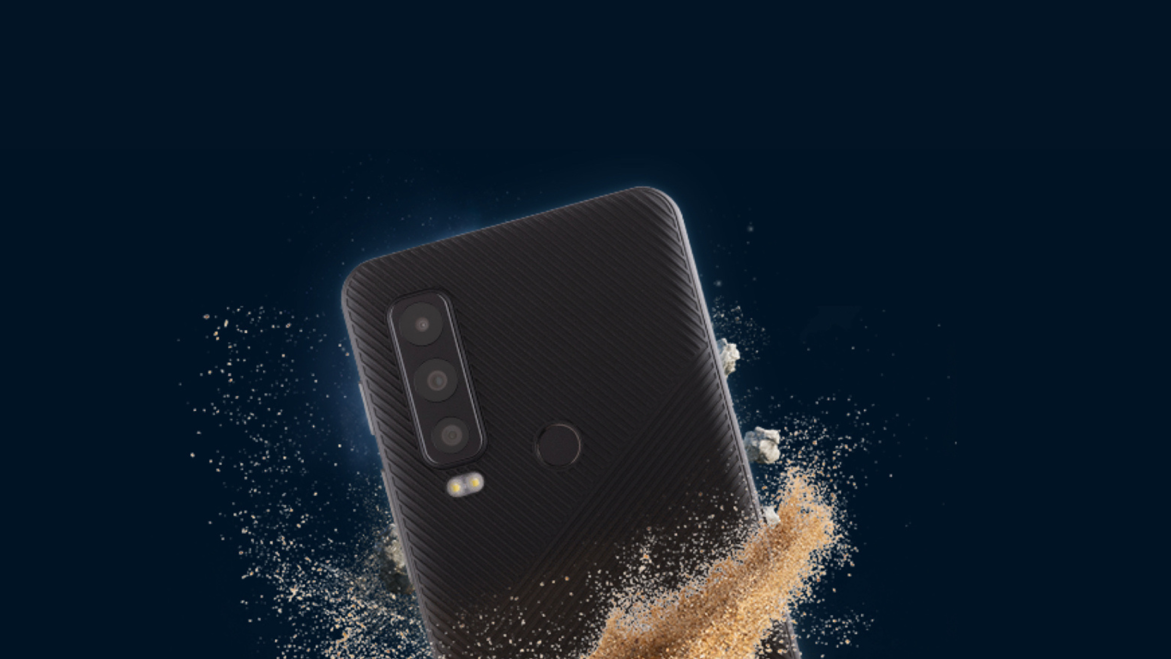 Motorola Defy 2 wrapped in sand