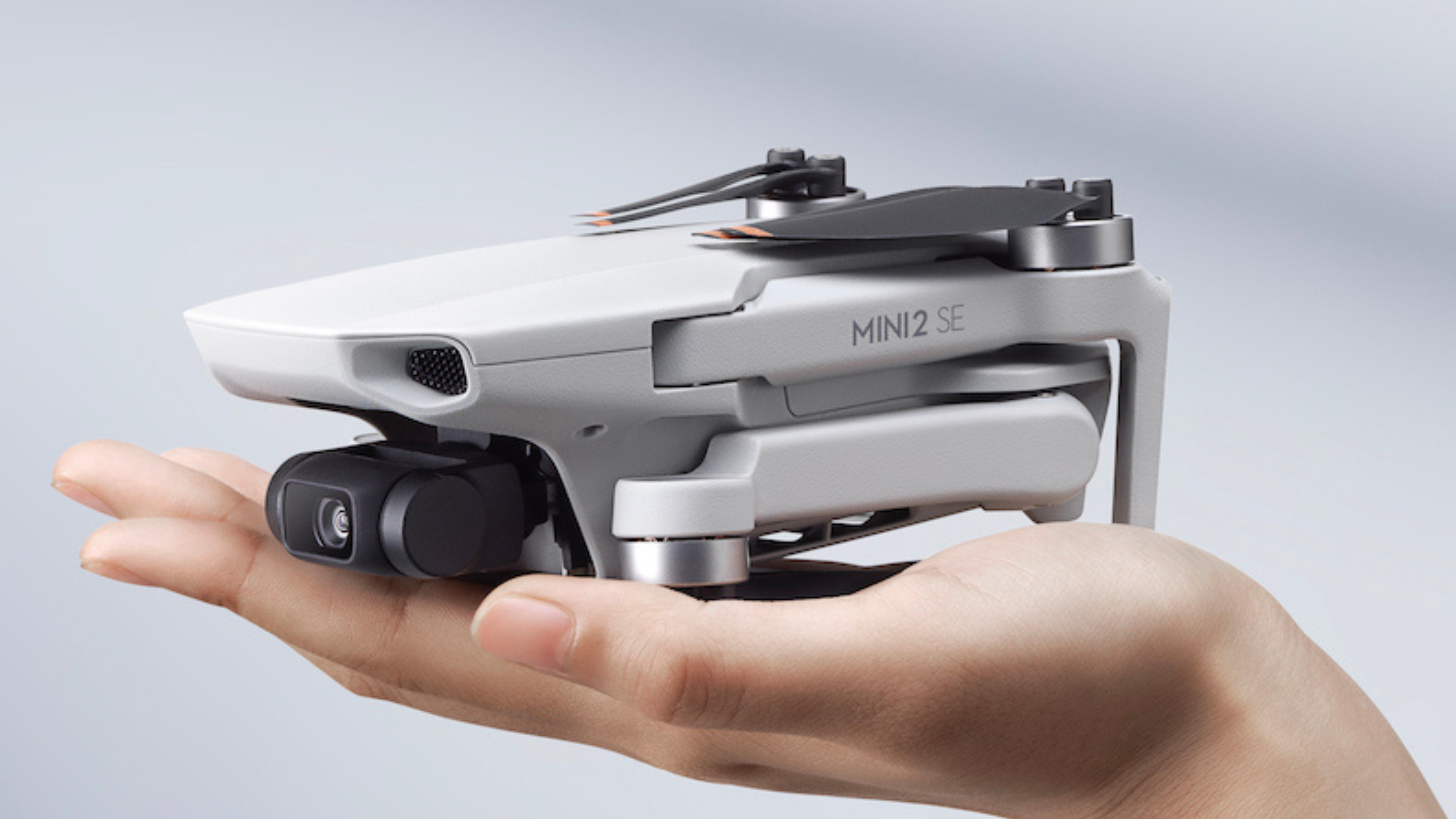 DJI Mini 2 SE in hand, showing how small it is