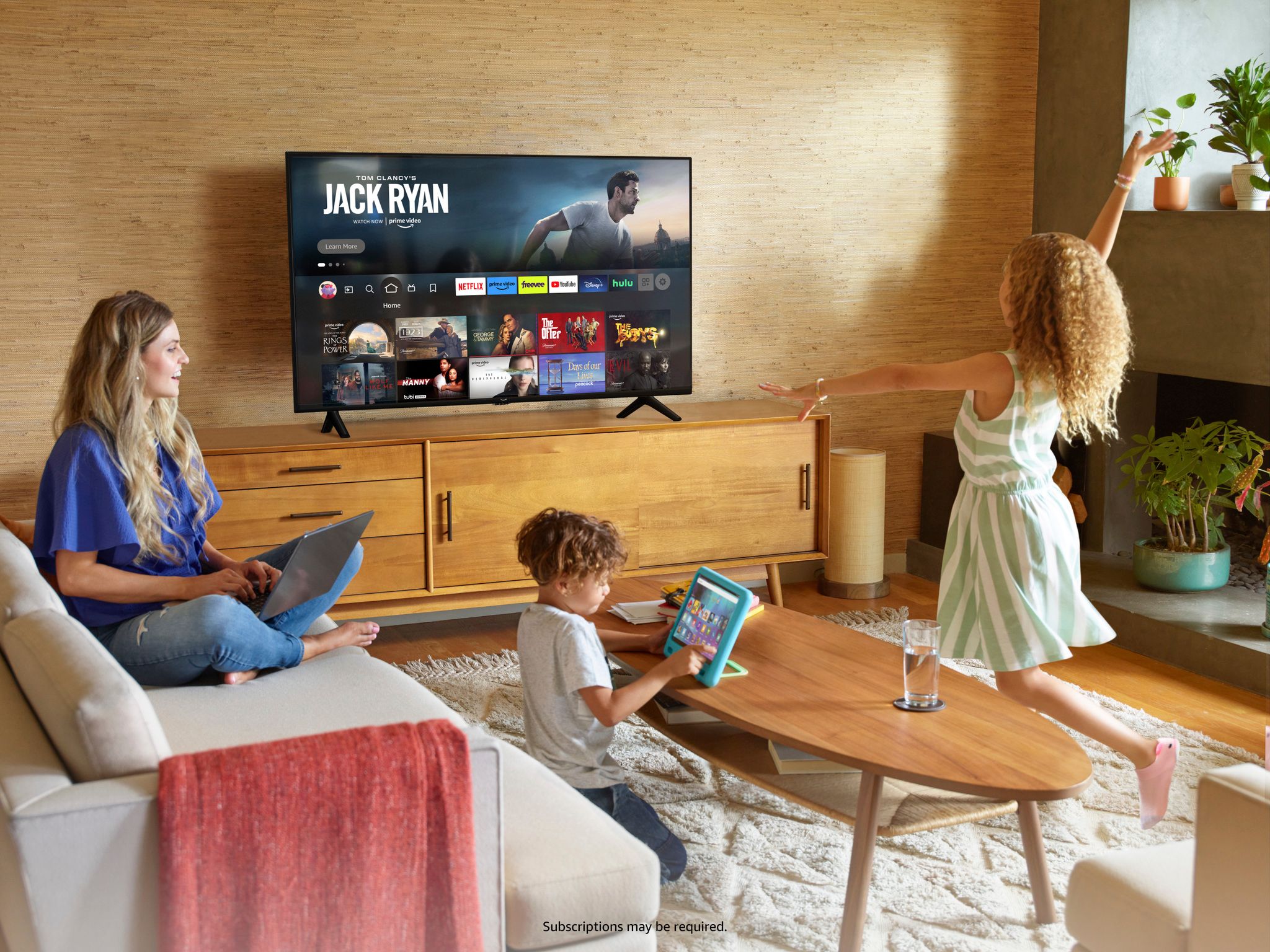 Family enjoying Amazon Fire TV 2 series television 