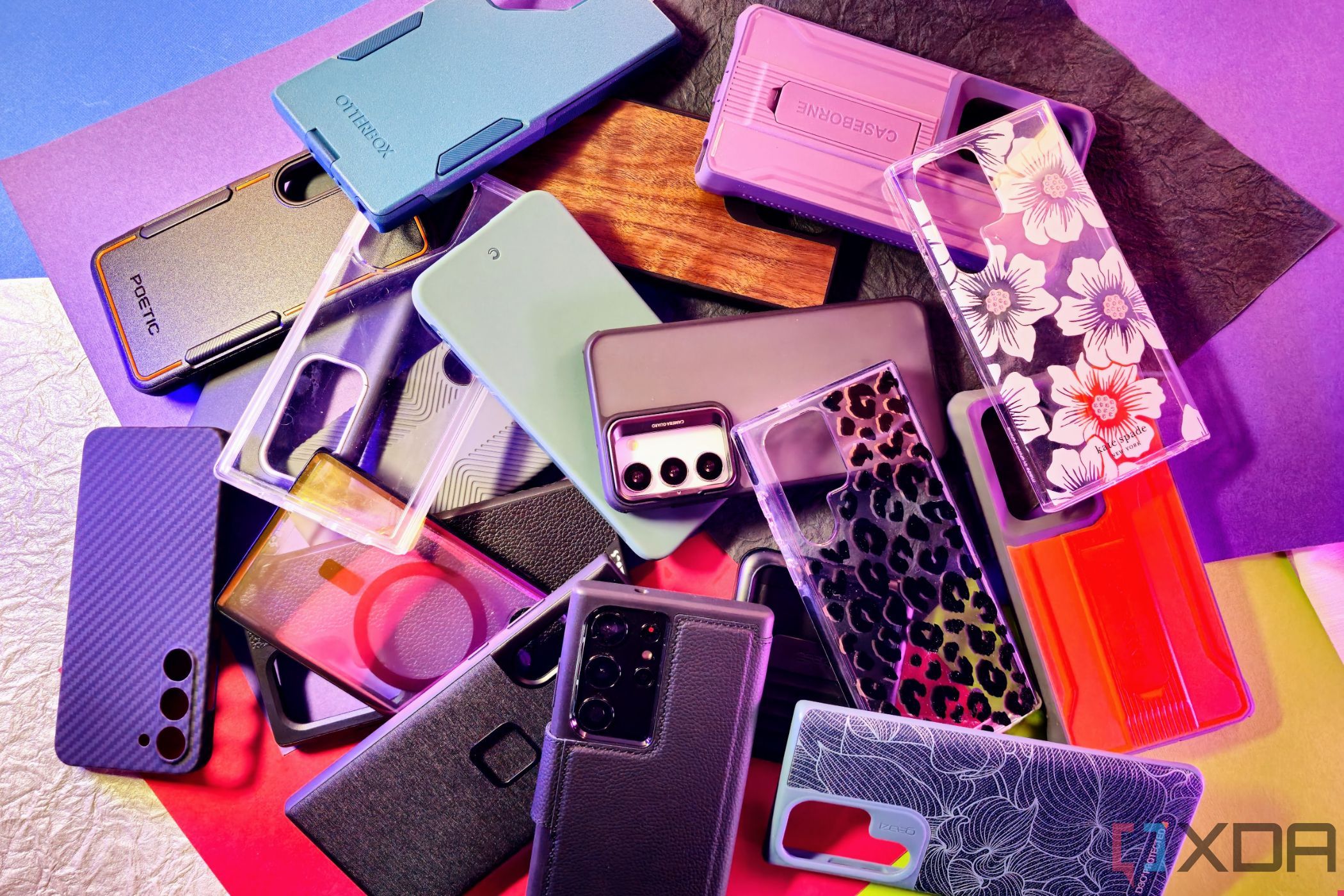 Pile of phone cases from Spigen, Speck, Otterbox, Incipio, Thinbourne, Casebourne, Peak, Mous, and more