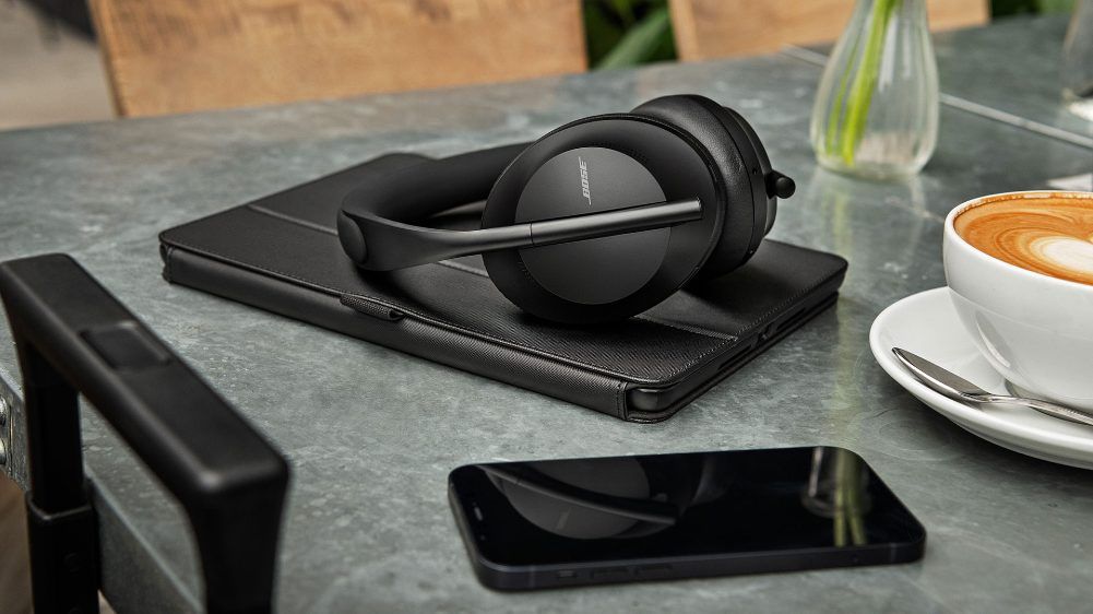 Bose 700 headphones lying on a tablet