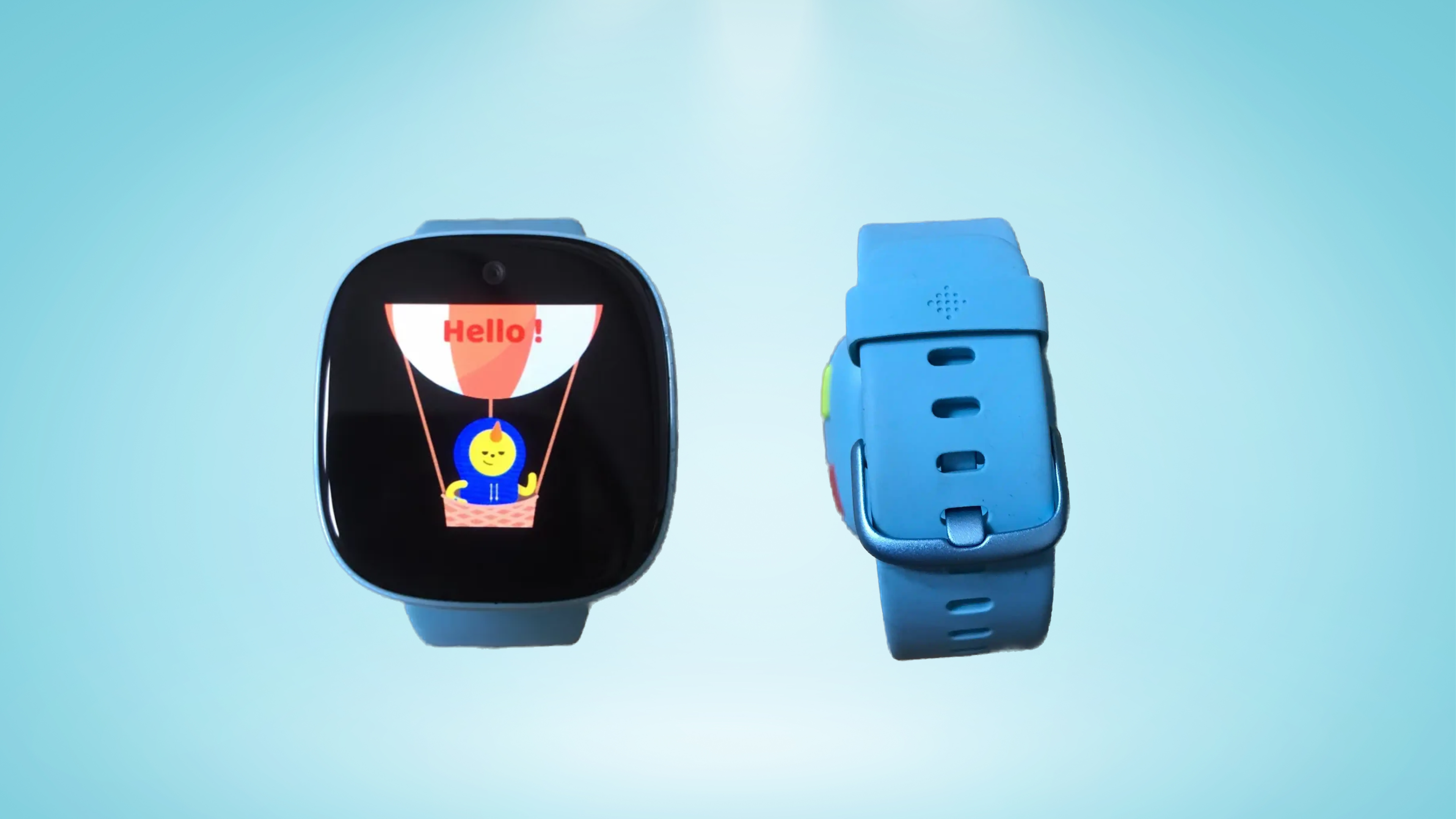 The front and rear of a light blue Fitbit smartwatch for kids, showing off strap and display with 