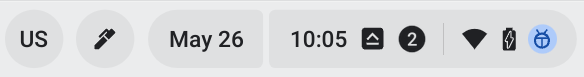 The Caps Lock indicator in ChromeOS is an icon with a caret on top of a horizontal line, located to the right of the time.